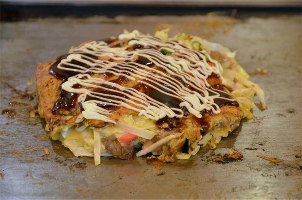 Grill-it-yourself okonomiyaki, topped with a sweet-savoury sauce and mayonnaise