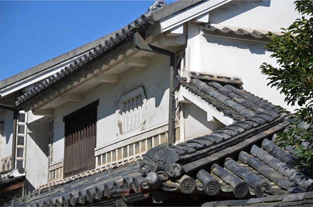 Cascading roof tiles that culminate in a fan