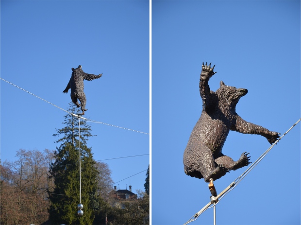 A comical bear on a tightrope