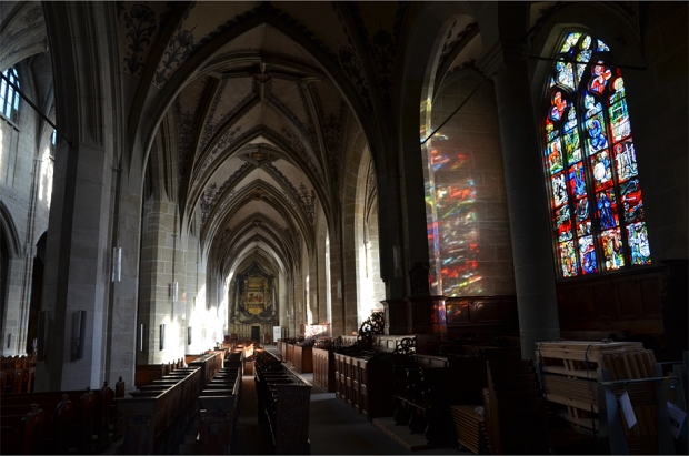 Stained glass brings welcome bursts of colored light into the rather bare interior