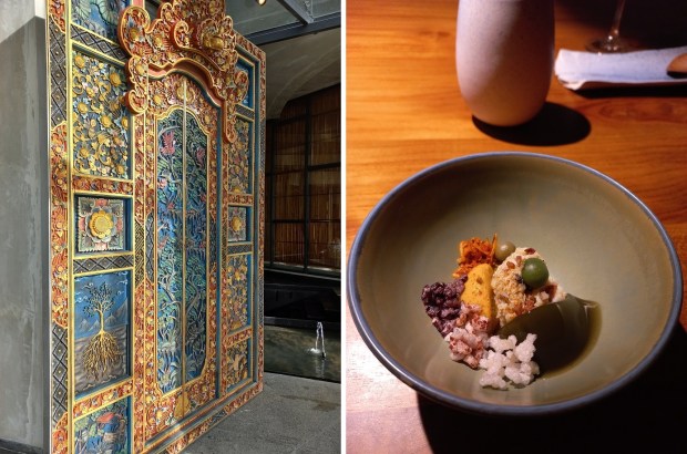 A handcarved pivot swing door at NXT; this dish features local heritage rice and mud crab