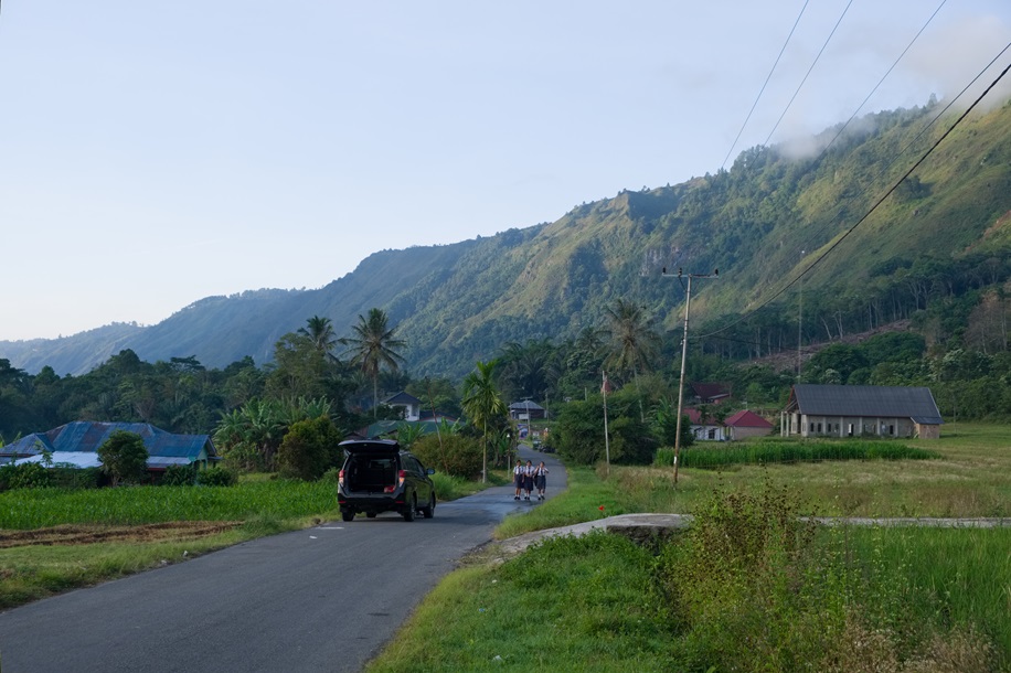 Kids walking to school down the road from the church